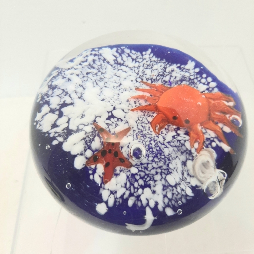 Blue and Orange Glass Paperweight with Crab and Starfish. 3.5 x 2.5 inches